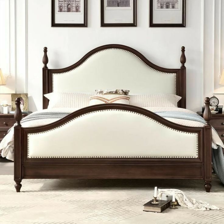 Colonial style arched upholstered teak wood double bed with cream padding and nailhead trim