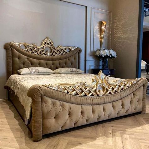 Luxurious ivory and gold leaf antique polish king-size bed featuring a hand-carved crown headboard and tufted velvet upholstery.
